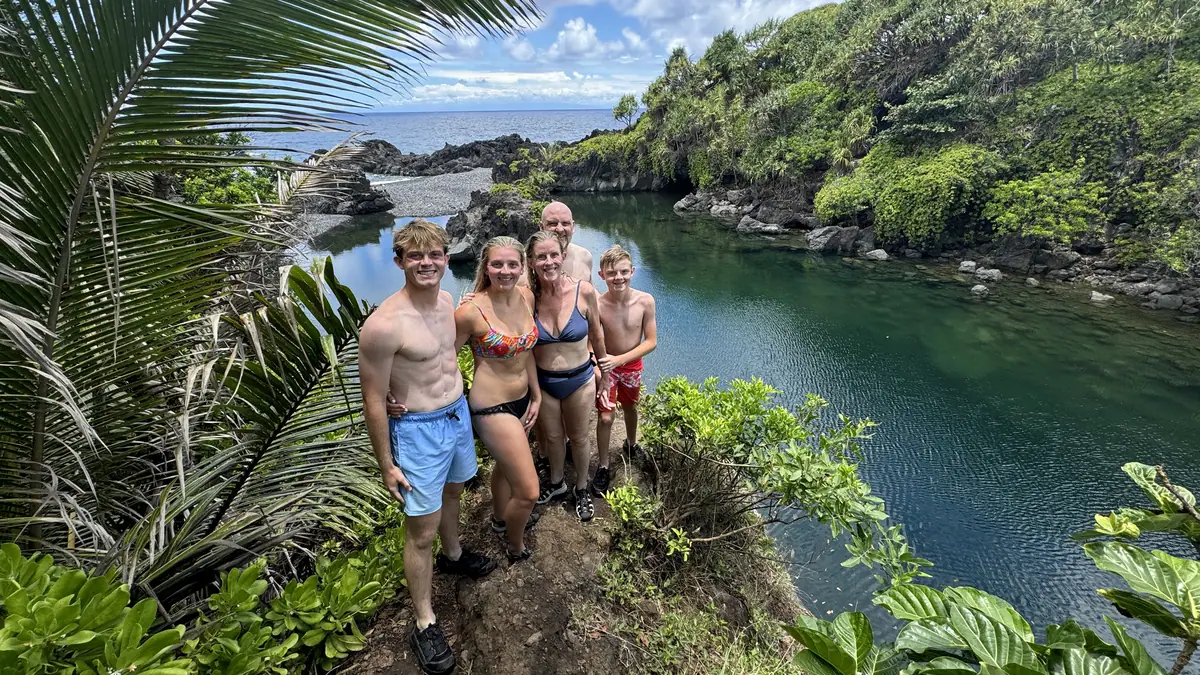 A group of guests standing above the freshwater pools