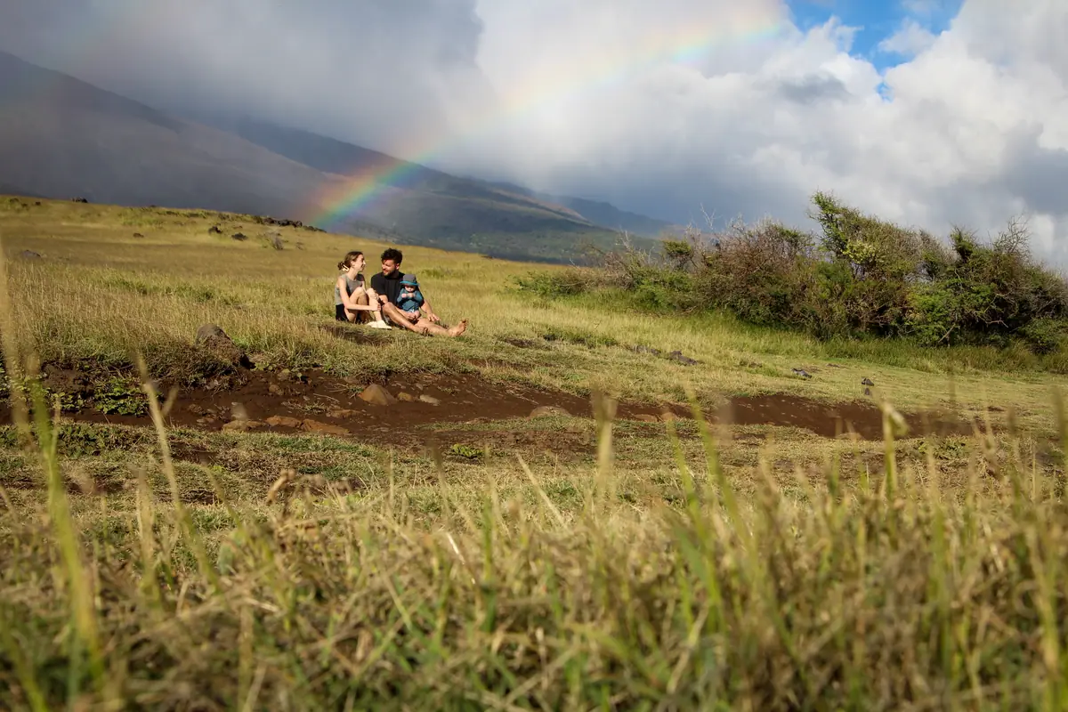 A rainbow arcing over an east Maui pasture